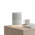 Nocturely White Noise Machine compact cylindrical design on a minimalist nightstand